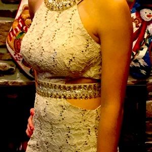 Cream colored lace dress w/ gold beading. Size 5.